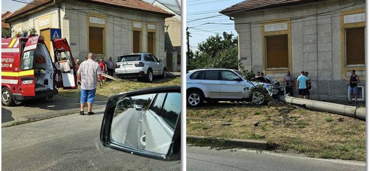 Sofer ranit, dupa ce a fost proiectat cu BMW-ul in stalp, la Timisoara. A fost lovit de un alt autoturism. Foto